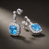 Winter Diamond™ Earrings — 18K White Gold | Cushion Blue Topaz